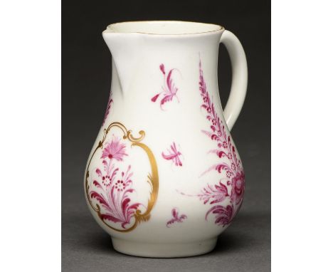 A Worcester sparrow beak cream jug, c1765, painted in puce monochrome with flowers, the central spray in gilt cartouche, the 