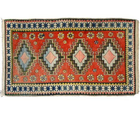 A medallion rug, 20th c,&nbsp;in polychrome, 220 x 125cm Good condition, light wear.