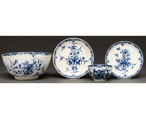 A Worcester blue and white slop basin, tea bowl and two saucers, c1770, painted with the Mansfield pattern, basin 15.5cm diam