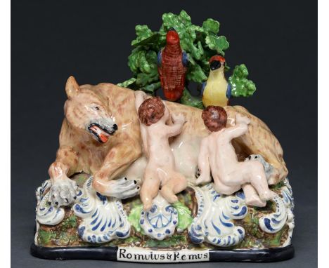 A Staffordshire earthenware group of Romulus and Remus suckled by the she wolf, c1825-30, with overglaze enamel painted decor