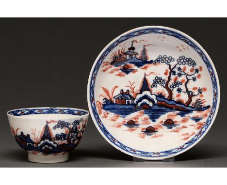 A Liverpool tea bowl and saucer, James Pennington, c1770, painted in underglaze blue and overglaze red enamel with the Cannon