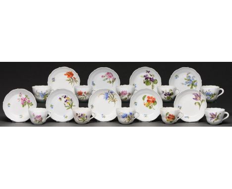 A set of ten Meissen coffee cups and eleven saucers, 20th c, painted with flowers, saucer 10.5cm diam, painted crossed swords