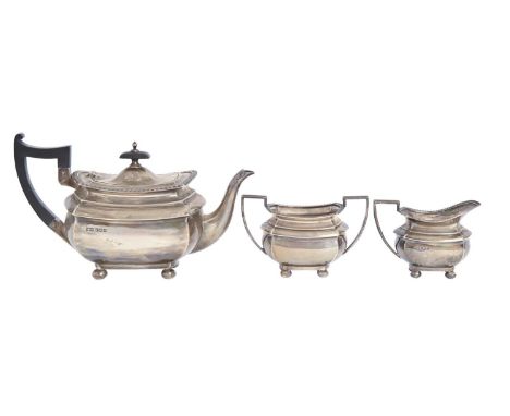 A George V three-piece gadrooned oblong silver tea service, teapot 15cm h, by Walker &amp; Hall, Sheffield 1936, 27ozs 17dwts