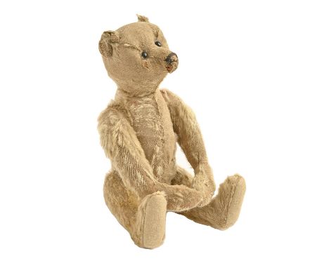 An early Steiff teddy bear, c1906, straw stuffed with black stitched muzzle and black boot button eyes, felt pads, 32cm h  Pr