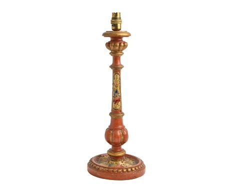 A polychrome wood lamp of candlestick form, painted with flowers in gilt cartouches on a scarlet ground, 42cm h excluding lam