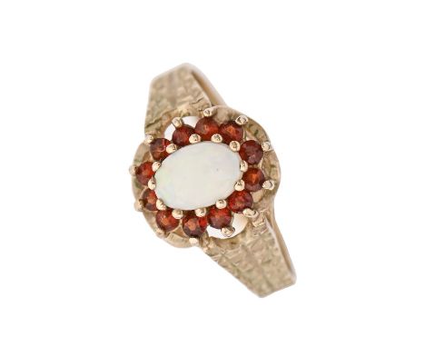 An opal and garnet cluster ring, in 9ct gold, London 1979, 2.7g, size O Good condition