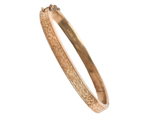 A Victorian 9ct gold bangle, one half foliate engraved, 61mm internal, Birmingham 1898, 8.3g Sharp dent on underside, not spl