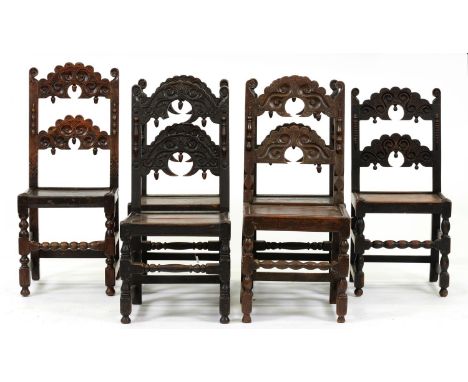 A harlequin set of six Derbyshire oak chairs, late 17th c and later,&nbsp;typical shaped arched ladder backs carved with scro