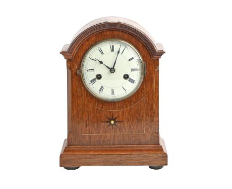 An oak mantel clock, early 20th c, with enamel dial and Gustav Becker gong striking movement, pendulum, 31cm h Good condition
