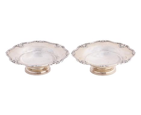 A pair of George VI silver bonbon dishes,&nbsp;shaped and reeded shell borders, circular pedestal bases, Adie Brothers Ltd, B