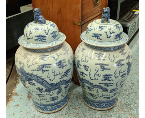 TEMPLE JARS, a pair, Chinese export style, blue and white ceramic. (2) 