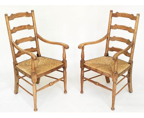 ARMCHAIRS, a pair, early 20th century English oak with ladder backs and rush seats, 55cm W. (2) 