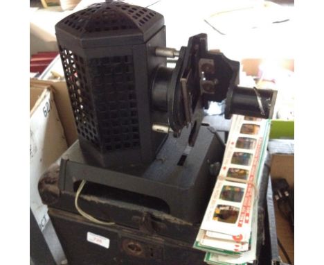 AN OLD CASED FILMOSTAR 3 PROJECTOR WITH QUANTITY OF CARTOON SLIDES   T2