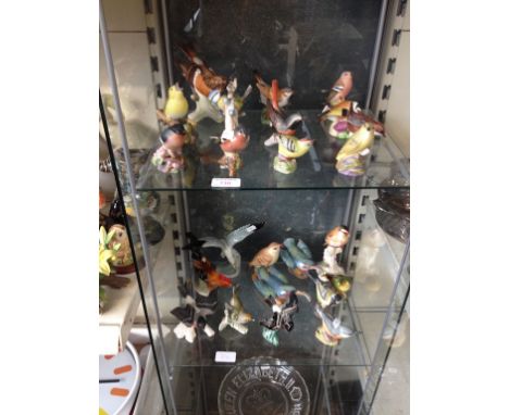 A COLLECTION OF 24 BIRD ORNAMENTS, INCLUDING ROYAL WORCESTER, BESWICK AND GOEBEL   C