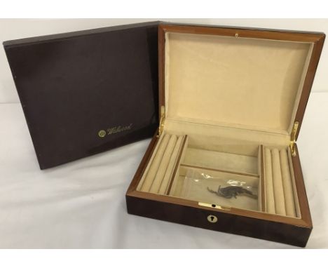 A brand new red wood  jewellery box by Walwood. Interior has 2 square compartments with ring/earring cushions to both sides. 