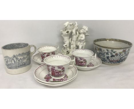 A small collection of antique ceramic items. To include blanc de chine bud vase with cherub and cups and saucers. 