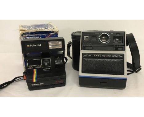 A boxed Polaroid Supercolor 635CL camera, complete with instructions. Together with a cased vintage Kodak EK6 Instant Camera.