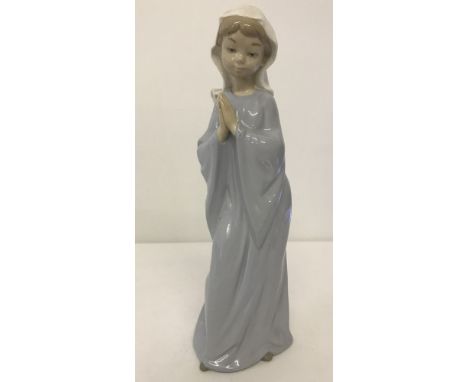 A Nao figurine of a young girl praying.  Approx. 27cm tall.