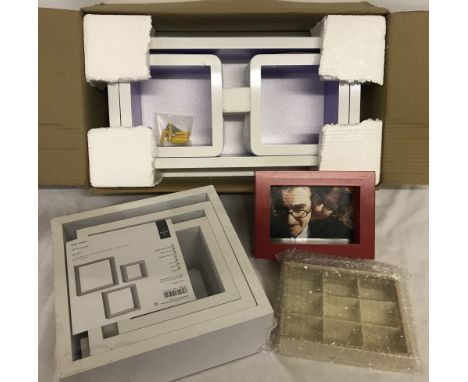 A new boxed wall hanging shelf together with a set of 3 wall cubes (new &amp; sealed). Plus 2 others. 