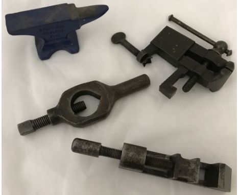 A Record miniature anvil, hand vice, Bench vice and 1 other.  