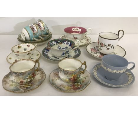 A collection of 9 vintage ceramic cups and saucers. To include a pair of Rockingham cups &amp; saucers with bird decoration, 