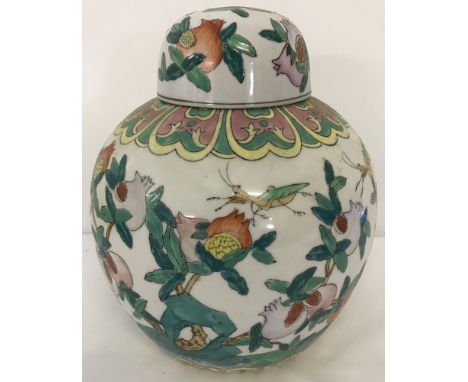 A large ceramic ginger jar with pomegranate decoration.  Approx. 25cm tall.
