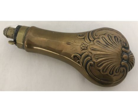 A copper and brass powder flask with classic clam shell decoration by Drake.  