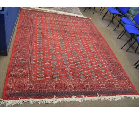 Bokhara style Caucasian carpet, central panel of six lines of lozenges interspersed by geometric designs within a multi-gull 