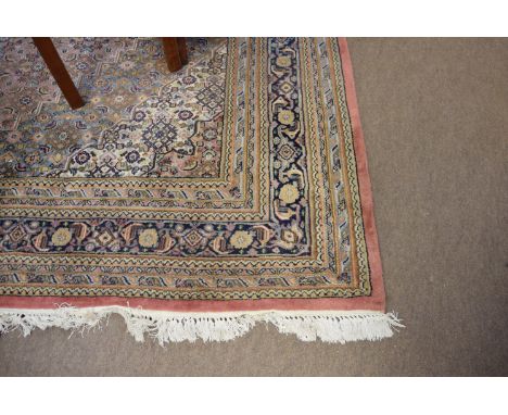 Late 20th century Caucasian style large carpet, multi-gull border, central single lozenge, mainly blue/puce/beige field, 254 