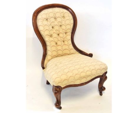 Victorian mahogany spoon back ladies chair, upholstered in pattern, button back, serpentine frieze and short C-scroll front s