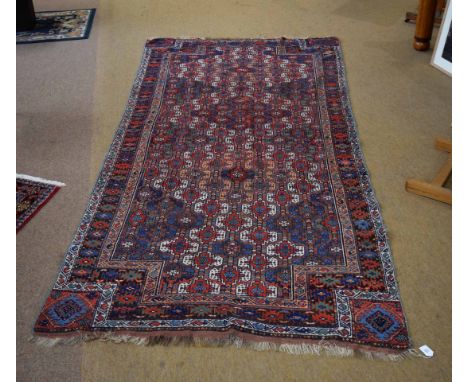 NE Persian Kurd&nbsp;wool carpet, triple gull border, central panel of interlinked geometric lozenges, mainly red and brown f