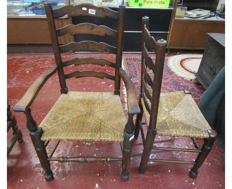 Set of six ladder back rush seated dining chairs to include 2 carvers