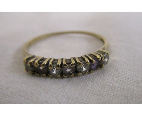 Gold stone set half hoop ring