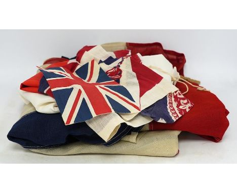 A vintage Union flag, approximately 240 x 120cm, a smaller “Sale” flag and other assorted flags and bunting. Condition - fair