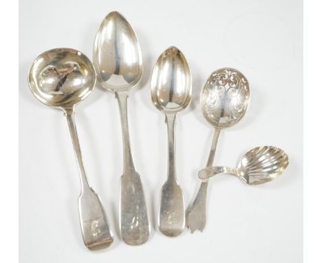 A quantity of assorted mainly 19th century silver flatware, including sauce ladles, table spoons, caddy spoon and sugar nips,