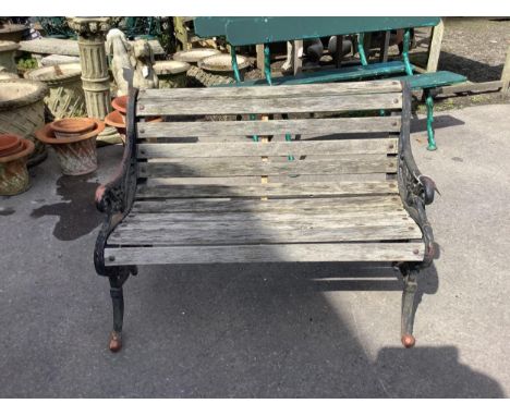 A Victorian style wrought iron slatted garden bench, width 122cm, height 82cm. Condition - fair