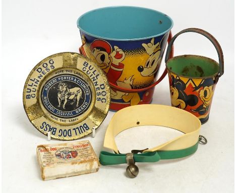 A vintage Bull Dog Bass and Guinness tinplate advertising ashtray, two Happynak Mickey Mouse toy buckets, a bakelite dog coll