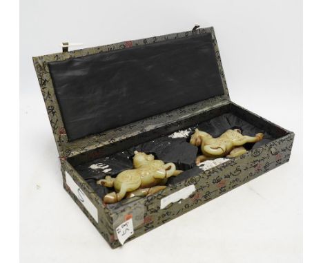 A pair of Chinese green jade horses, Han style, cased, 15cm wide. Condition - good