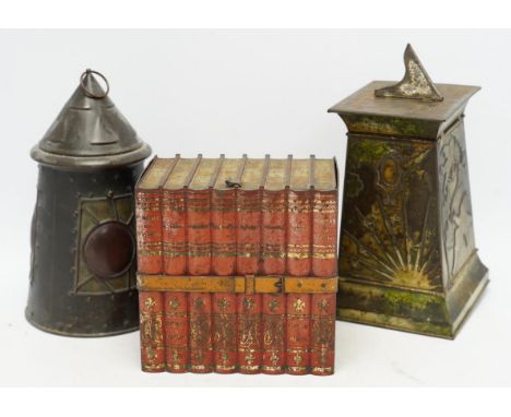 Three early 20th century Huntley &amp; Palmer novelty biscuit tins, modelled as bound books, a sun dial and an Arts &amp; Cra