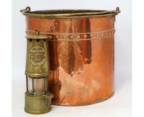A brass handled copper coal bin and The Protector brass miner’s lamp, coal bin 30cm high. Condition - coal bin has some minor