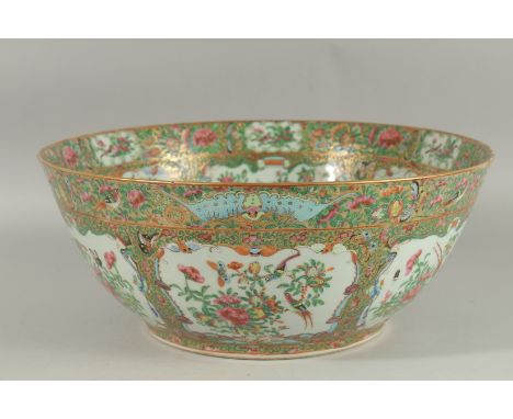 A LARGE AND FINE 19TH CENTURY CHINESE CANTON FAMILLE ROSE PORCELAIN PUNCH BOWL, enamel painted with panels of birds, butterfl