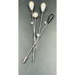 A small selection of seven hat pins.