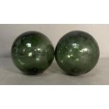 Two green glass fishing floats