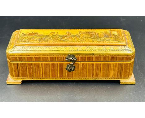 A vintage wooden scent bottle box with four small scent bottles