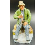 A Royal Doulton figure of a fisherman titled "A Good Catch"