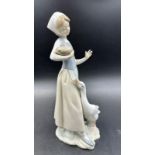 A Lladro figurine of a lady and goose