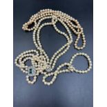 A selection of costume pearl jewellery to include necklaces and bracelets