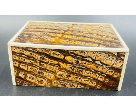 A vintage Fortnum and Mason of London cigarette box in a faux snakeskin effect 