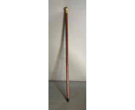 A walking cane in three sections with internal glass lined hip flask and compass 