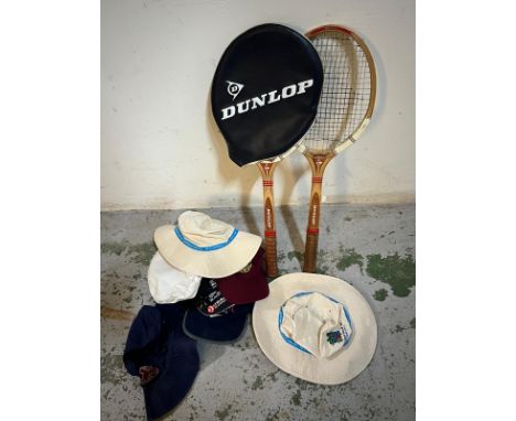 Two vintage wooden tennis rackets and sporting hats 